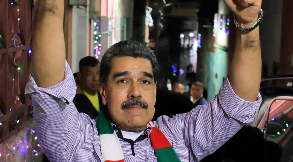 Venezuela Devlet Başkanı Nicolas Maduro, Karakas'ın San Agustin mahallesinde düzenlenen bir Noel kutlamasına katıldı (Reuters)