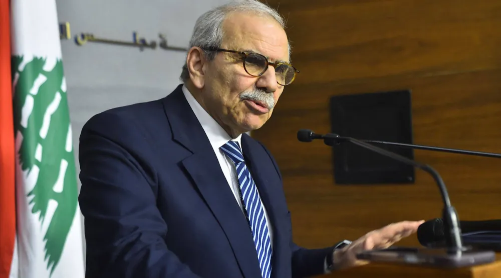A photograph released by the Lebanese Government Press Office on December 26, 2025, show Prime Minister Nawaf Salam speaking during a press conference after a cabinet session in Beirut on December 26, 2025. (Photo by Handout / Lebanese Government Press Office / AFP)
