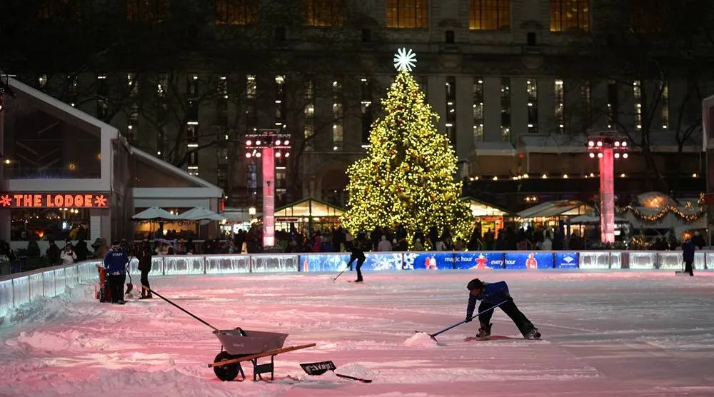  Workers clear snow from the ice rink at Bryant Park during a winter storm in New York City, US, December 26, 2025. (Reuters)