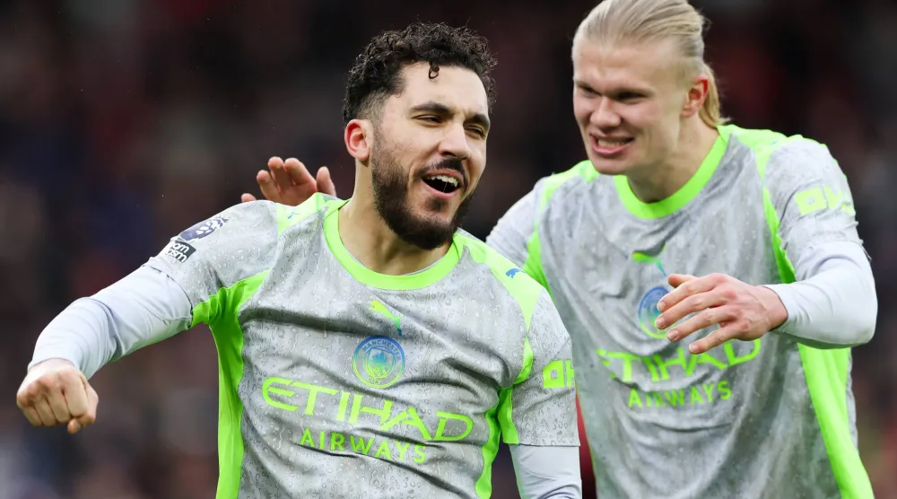  27 December 2025, United Kingdom, Nottingham: Manchester City's Rayan Cherki (L) celebrates scoring his side's second goal with teammate Erling Haaland during the English Premier League soccer match between Nottingham Forest and Manchester City at the City Ground. (Barrington Coombs/PA Wire/dpa_
