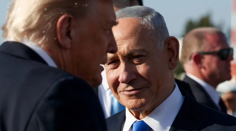 Israeli Prime Minister Benjamin Netanyahu looks on next to US President Donald Trump as Trump leaves Israel en route to Sharm El-Sheikh, Egypt, to attend a world leaders' summit on ending the Gaza war, amid a US-brokered prisoner-hostage swap and ceasefire deal between Israel and Hamas, at Ben Gurion International Airport in Lod, Israel, October 13, 2025. (Reuters)