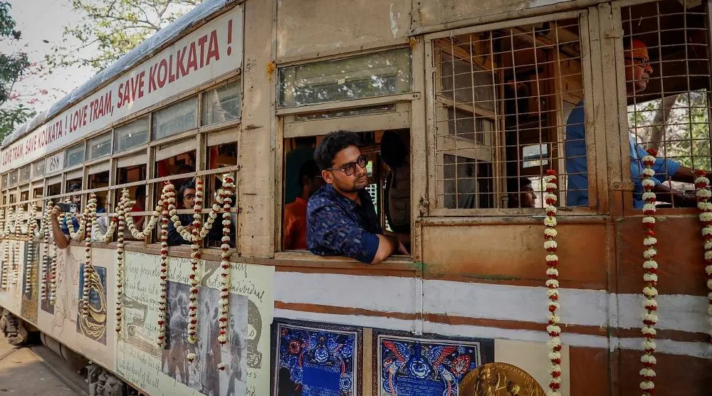 Passengers sit inside a decorated tram during the 152nd anniversary celebrations of trams in Kolkata, India, February 24, 2025. (Reuters)