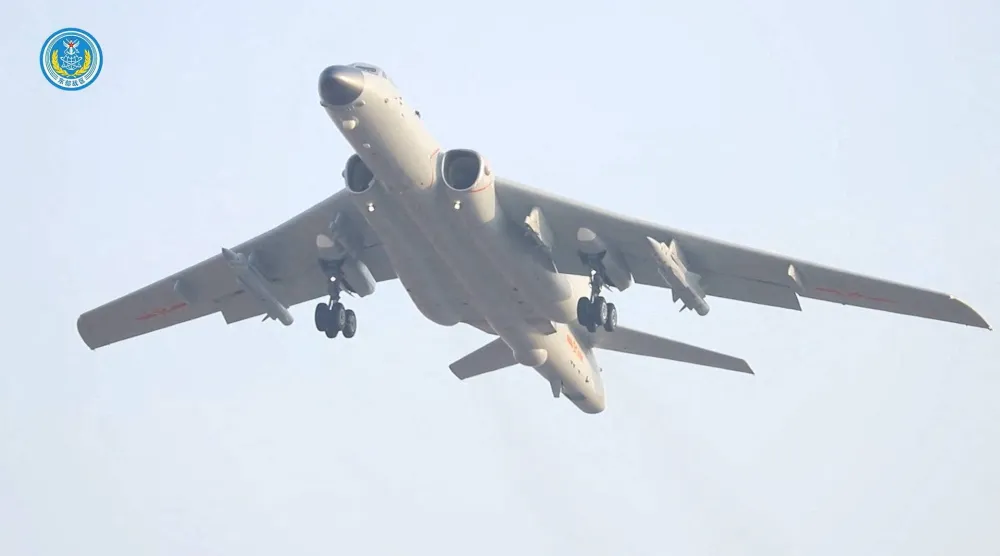 صورة من شريط فيديو لقاذفة صينية تقلع من مكان غير محدد للمشاركة في المناورات حول تايوان الاثنين (رويترز)