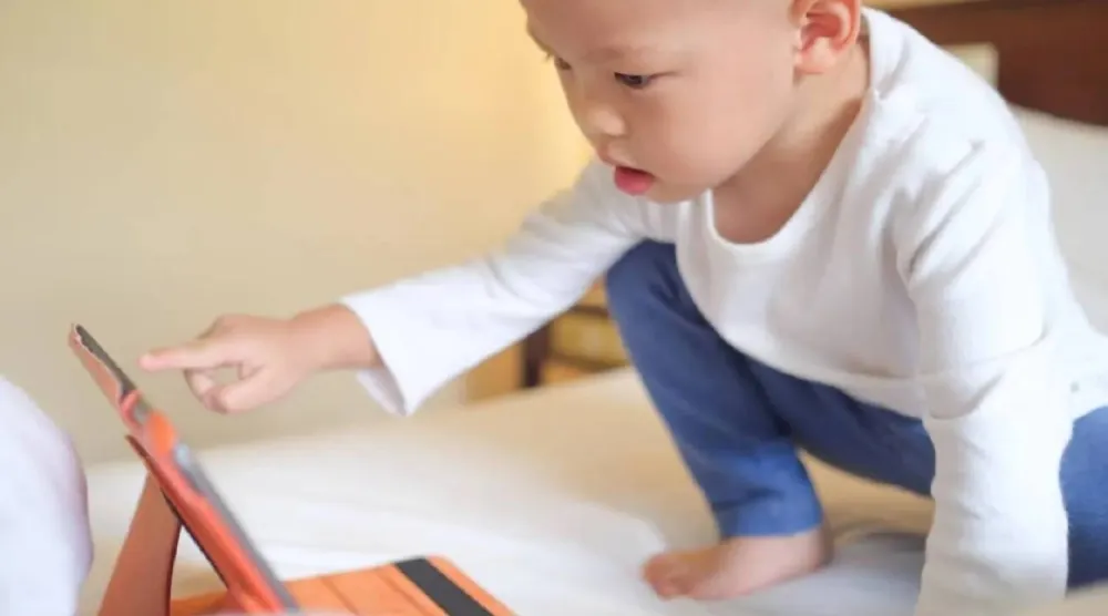 The study concluded that children exposed to high levels of screen time before age two are exposed to endure adolescent mental health. (The University of Queensland)