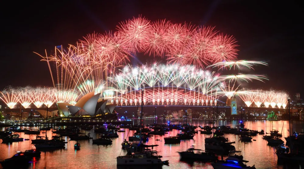 Fireworks are seen over Sydney Harbour during the New Year's Eve midnight display, at Mrs Macquaries Point in Sydney, 01 January 2026. EPA/DAN HIMBRECHTS