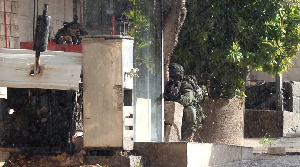 Israeli troops during a military operation in the Palestinian village of Qabatiya, near the West Bank city of Jenin, 27 December 2025. (EPA)