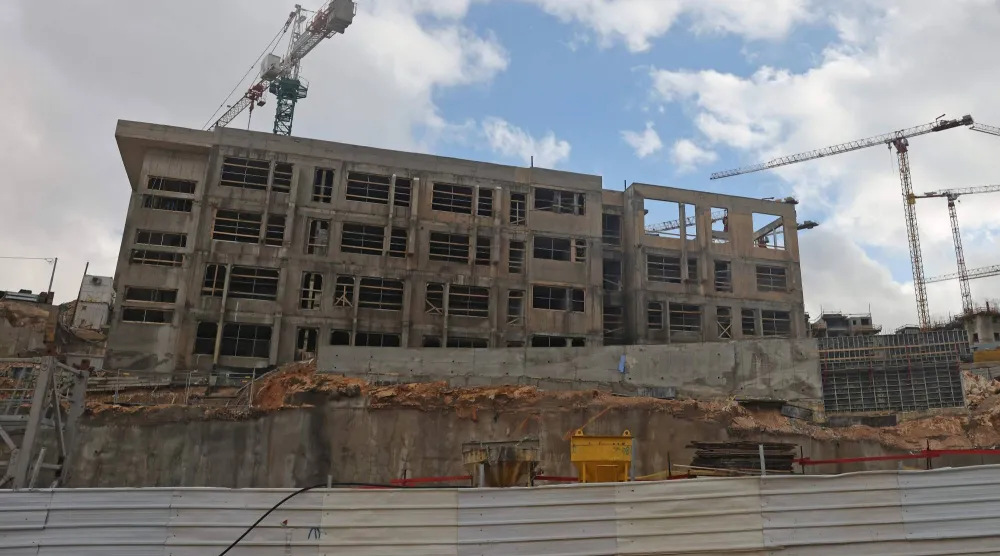 Construction cranes tower above a construction site in Givat HaMatos, an Israeli settlement suburb of Israeli-annexed east Jerusalem on January 2, 2026. (AFP)