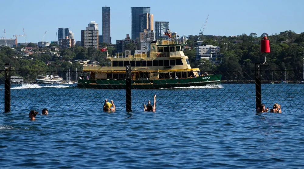 Swimmers at Marrinawi Cove in Sydney, Thursday, January 8, 2026. EPA/BIANCA DE MARCHI