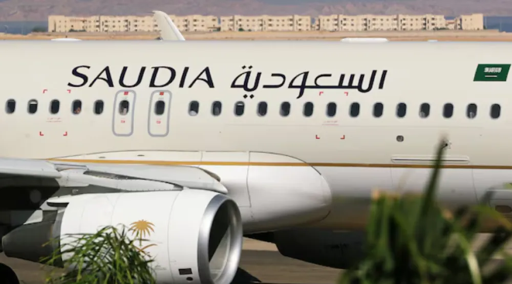 Saudi Arabian Airlines plane, is seen at the airport of the Red Sea resort of Sharm el-Sheikh, Egypt, August 9, 2021. Picture taken through a window. REUTERS/Mohamed Abd El Ghany/File Photo