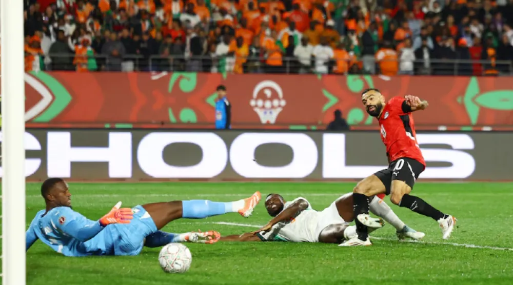 Soccer Football - CAF Africa Cup of Nations - Morocco 2025 - Quarter Final - Egypt v Ivory Coast - Adrar Stadium, Agadir, Morocco - January 10, 2026 Egypt's Mohamed Salah scores their third goal REUTERS/Siphiwe Sibeko 