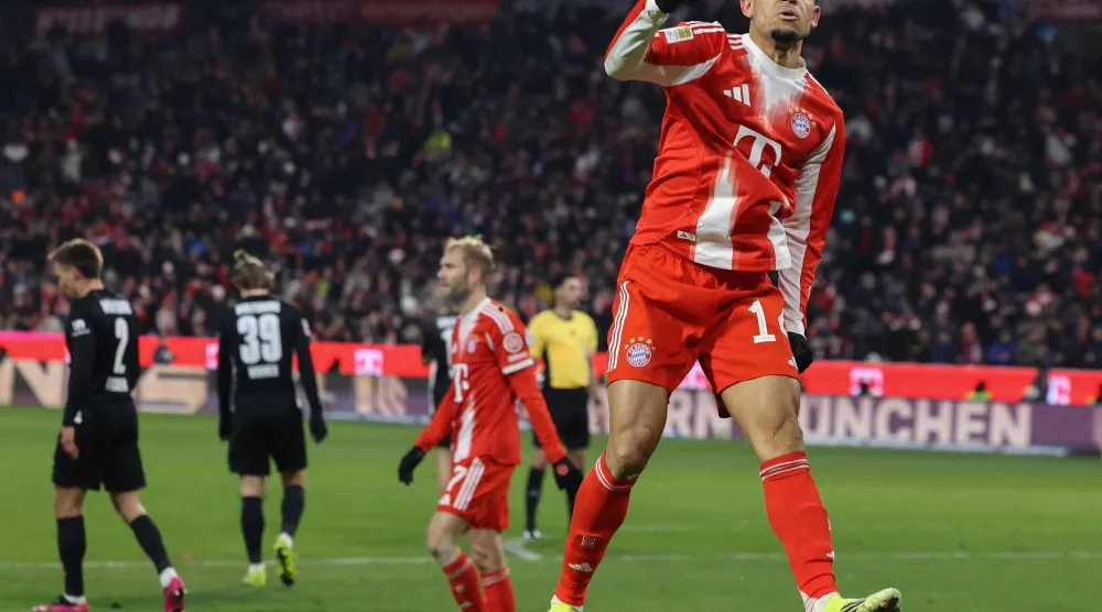 لويس دياز يحتفل بهدفه في فولفسبورغ (أ.ف.ب) 