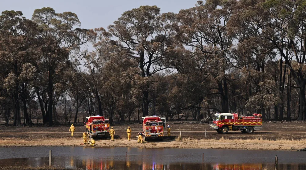 Country Fire Authority (CFA) crew fill up tankers in the bushfire affected town of Ruffy, Victoria, Australia, 12 January 2026. (EPA)