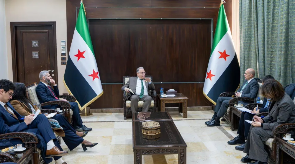 برنية خلال استقباله وفد مؤسسة التمويل الدولية بدمشق (حساب وزير المالية السوري بـ«فيسبوك»)