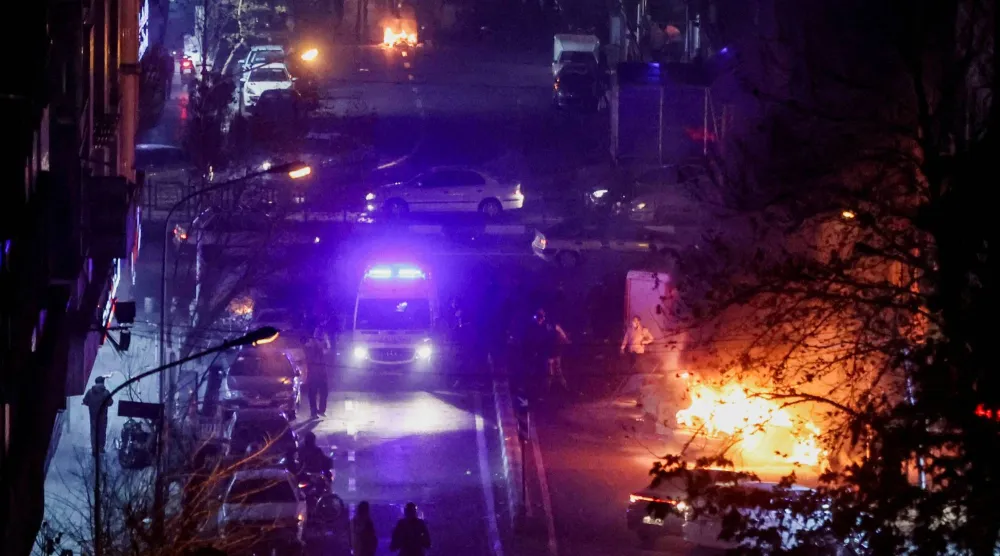  Cars burn in a street during a protest over the collapse of the currency's value, in Tehran, Iran, January 8, 2026. Stringer/WANA (West Asia News Agency) via Reuters