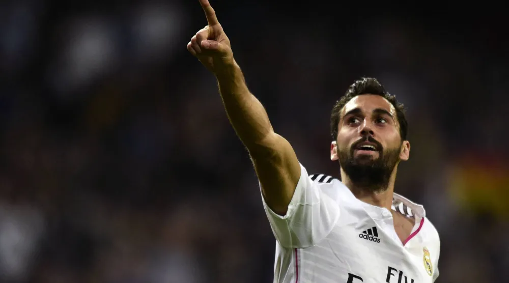 Real Madrid's defender Alvaro Arbeloa celebrates after scoring a goal during the Spanish league football match Real Madrid CF vs UD Almeria at the Santiago Bernabeu stadium in Madrid on April 29, 2015. (AFP)