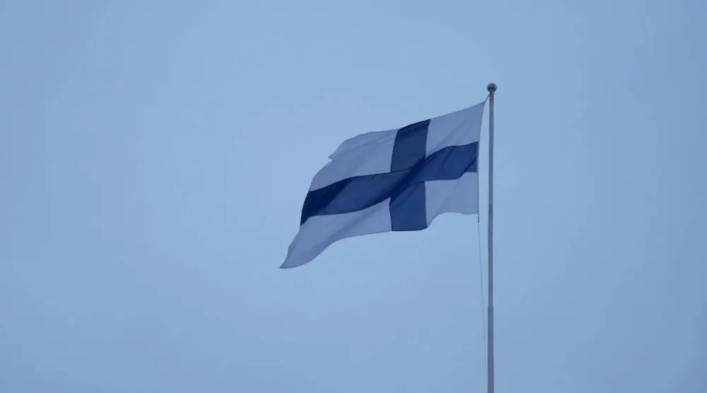 A Finnish flag flies over the City Hall in Helsinki, Finland, February 10, 2024. REUTERS/Tom Little/File photo
