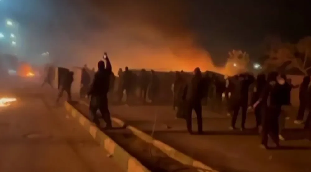 This video grab taken on January 13, 2026 from UGC images posted on social media on January 10, 2026 shows clashes in Mashhad, in northeastern Iran. (UGC/AFP)