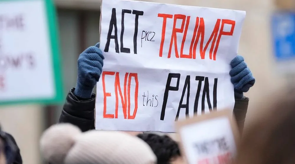 Protesters participate in a demonstration supporting protesters in Iran, in front of the US Consulate, Milan, Italy, Tuesday, Jan. 13, 2026. (AP)