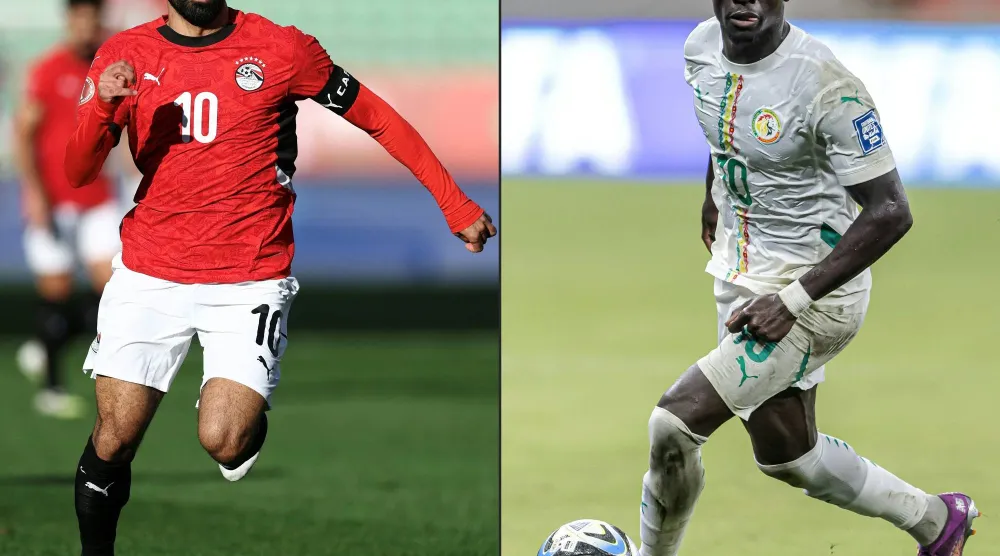 صلاح وماني تتشابه مسيرتهما في النجومية العالمية أو المشروعات الإنسانية (أ.ف.ب)