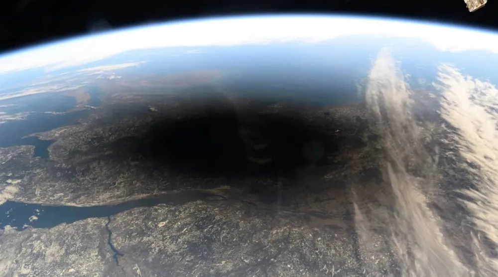 FILE - This photo provided by NASA shows the Moon's shadow covering portions of Canada and the US during a total solar eclipse as seen from the International Space Station on Monday, Aug. 8, 2024. (NASA via AP, File)
