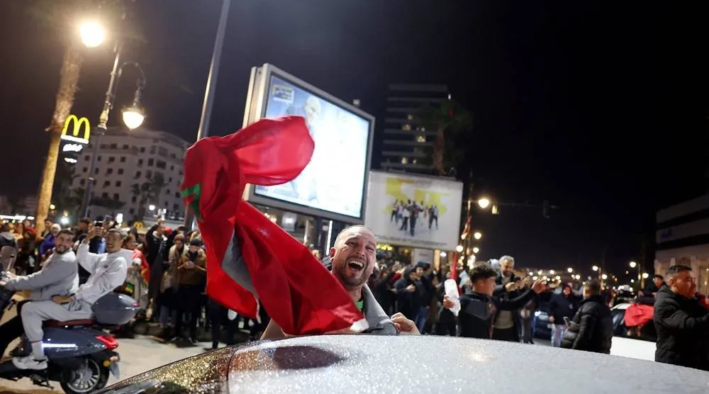  Soccer Football - CAF Africa Cup of Nations - Morocco 2025 - Tangier, Morocco - January 14, 2026 Morocco fans celebrate after winning their semi-final against Nigeria. (Reuters)