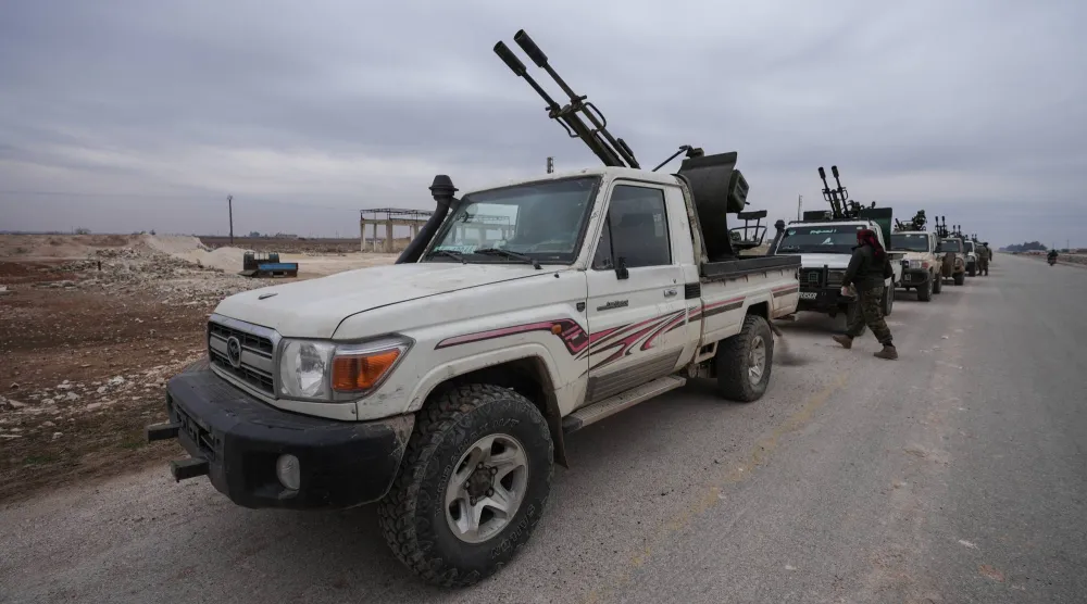 Syrian army convoys enter the Deir Hafer area in the eastern Aleppo countryside, Syria, after the Kurdish-led Syrian Democratic Forces (SDF) announced the handover of the area west of the Euphrates to the Syrian government, 17 January 2026. EPA/AHMAD FALLAHA