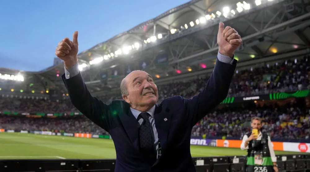 FILE - Fiorentina President Rocco Commisso gestures to club fans from the field ahead of the Conference League Final soccer match between Olympiacos FC and ACF Fiorentina at OPAP Arena in Athens, Greece, on May 29, 2024. (AP Photo/Petros Giannakouris, File)