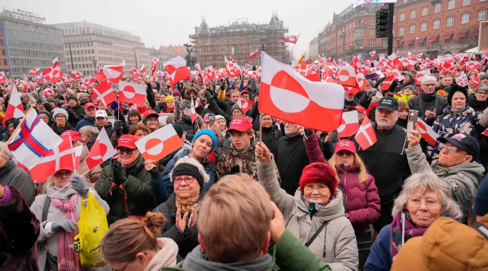 Protesters wave Greenlandic flags as they take part in a rally under the slogans 'hands off Greenland' and 'Greenland for Greenlanders', in front of City Hall in Copenhagen, Denmark on January 17, 2026. (Photo by Emil Helms / Ritzau Scanpix / AFP)
