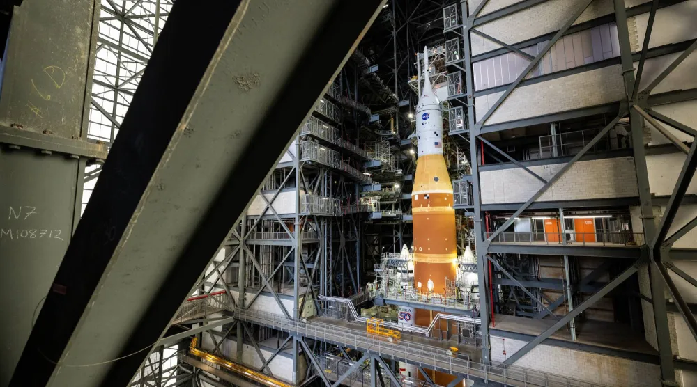 NASA's Artemis II SLS (Space Launch System) rocket and Orion spacecraft, secured to the mobile launcher, is seen inside the Vehicle Assembly building as preparations continue for roll out to Launch Pad 39B, Thursday, Jan. 15, 2026, at NASA's Kennedy Space Center in Florida. (Keegan Barber/NASA via AP)