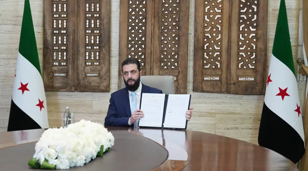Syrian President Ahmed al-Sharaa after signing an agreement at the presidential palace in Damascus on January 18, 2026. (EPA)