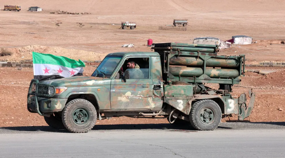 A military vehicle of the Syrian army is parked on the highway near Tabqa, after the Syrian army took control of it, Syria, January 19, 2026. (Reuters)
