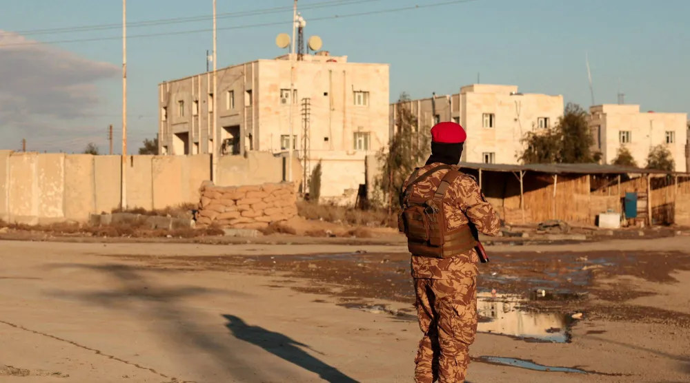  A member of Syrian military police stands guard near Raqqa prison, after the army took control of the city of Raqqa, Syria January 19, 2026. (Reuters)