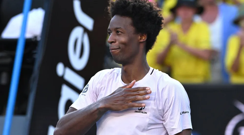 Gael Monfils of France acknowledges to the crowds after losing his Men’s Singles first round match against Dane Sweeny of Australia at the Australian Open tennis tournament in Melbourne, Australia, 20 January 2026. (EPA)