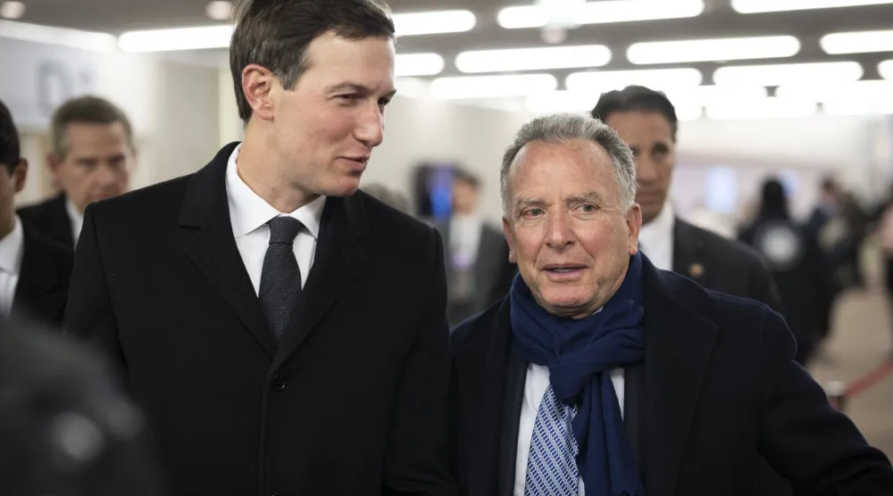 Jared Kushner (L), American businessman and Steve Witkoff (R), United States Special Envoy to the Middle East and special envoy for peace missions walk in the corridors during the 56th annual meeting of the World Economic Forum (WEF) in Davos, Switzerland, 20 January 2026. (EPA)