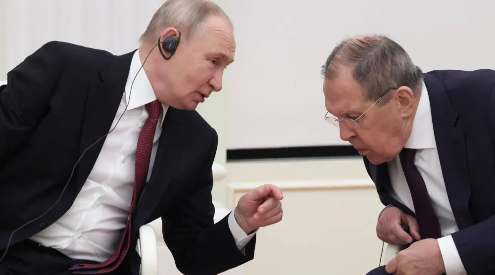 Putin with his Foreign Minister Lavrov (EPA)