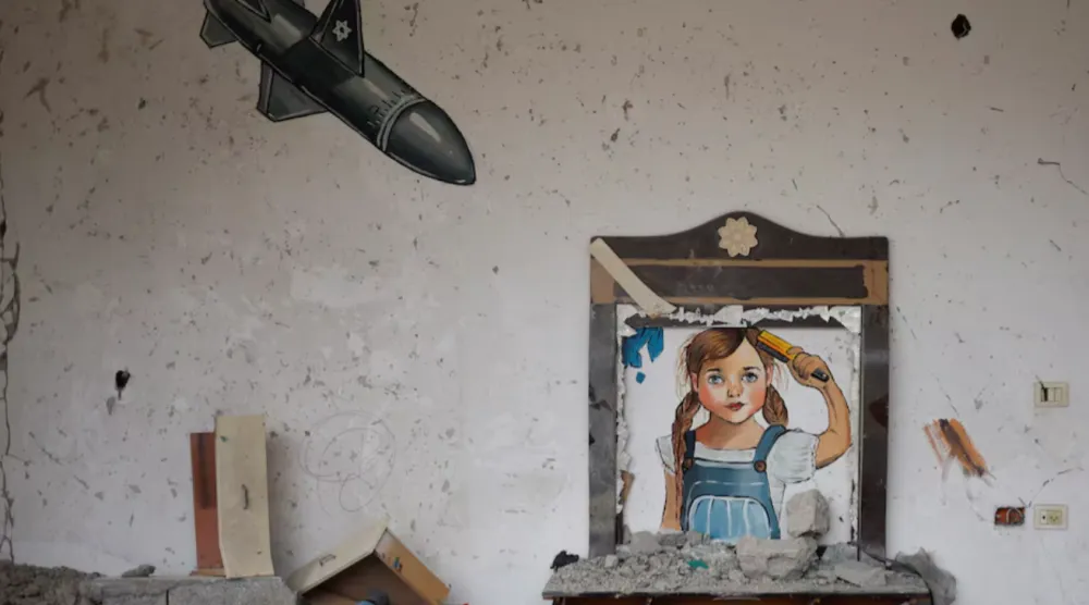 A painting drawn by artists is seen at a house destroyed by Israel, in recent Israeli-Gaza fighting, in Deir Al-Balah, central Gaza Strip June 13, 2023. REUTERS/Mohammed Salem 