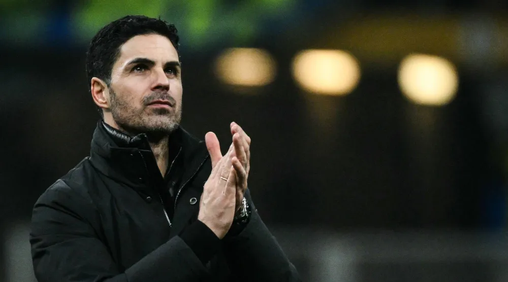 Arsenal's Spanish manager Mikel Arteta applauds at the end of the UEFA Champions League, league phase day 7, football match between Inter Milan and Arsenal at San Siro stadium in Milan, northern Italy, on January 20, 2026. (AFP)