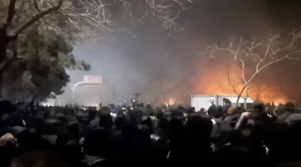 Smoke rises as protesters gather amid evolving anti-government unrest at Vakilabad highway in Mashhad, Razavi Khorasan province, Iran, released on January 10, 2026, in this screen grab obtained from a social media video. SOCIAL MEDIA/via REUTERS 