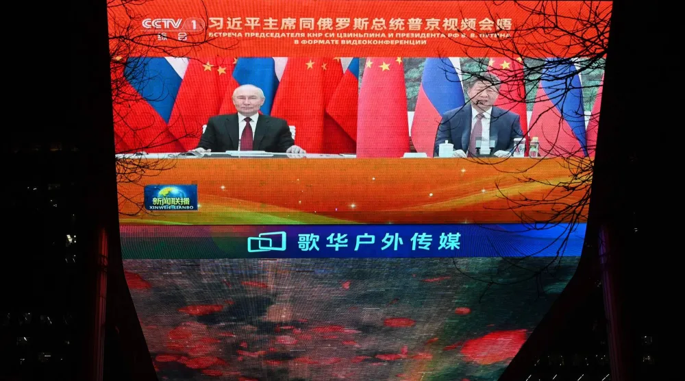 الرئيس الروسي ونظيره الصيني شي جينبينغ خلال مكالمة عبر تقنية الفيديو