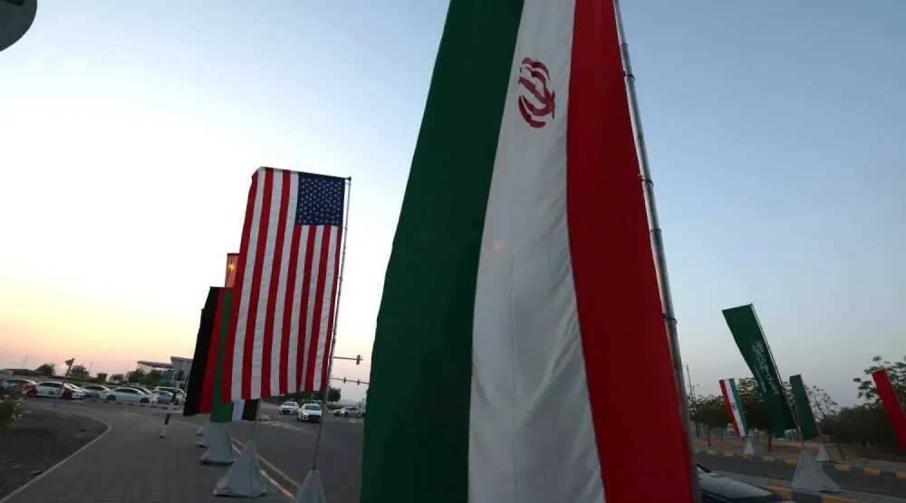 The flags of USA and Iran are displayed in Muscat, Oman, 25 April 2025. EPA/ALI HAIDER

