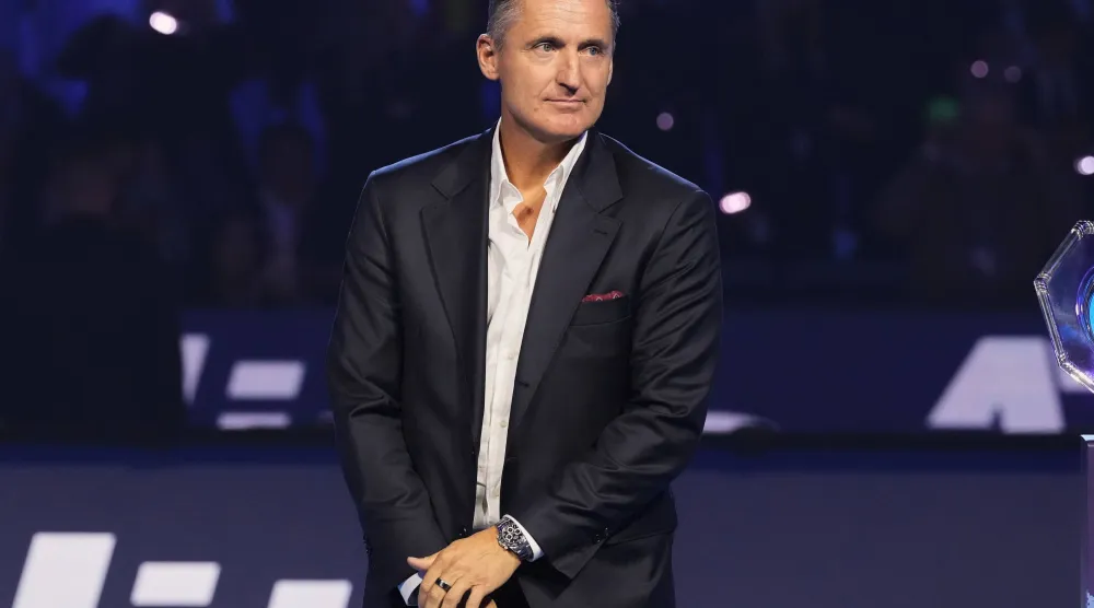 FILE - ATP President Andrea Gaudenzi stands at the end of the singles tennis final match of the ATP World Tour Finals, in Turin, Italy, Nov. 16, 2025. (AP Photo/Antonio Calanni, File)