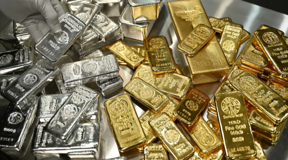 Gold and silver bars are stacked in the safe deposit boxes room of the Pro Aurum gold house in Munich, Germany, January 10, 2025. REUTERS/Angelika Warmuth 