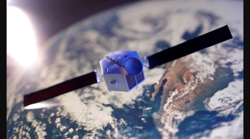 صورة مركبة لنموذج قمر اصطناعي مع خلفية لكوكب الأرض (رويترز)