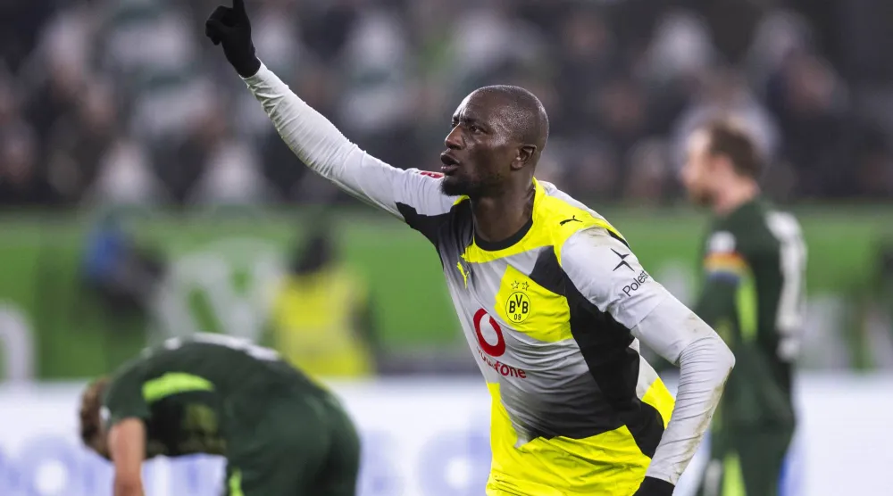 07 February 2026, Lower Saxony, Wolfsburg: Borussia Dortmund's Serhou Guirassy celebrates scoring his side's second goal during the German Bundesliga soccer match between VfL Wolfsburg and Borussia Dortmund at Volkswagen Arena. (dpa) 