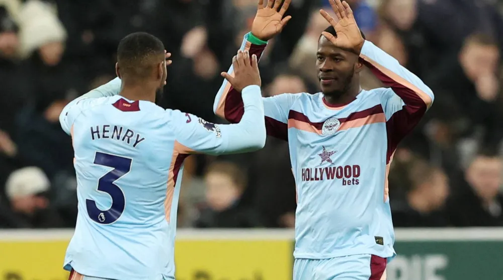 Football - Premier League - Newcastle United v Brentford - St James' Park, Newcastle, Britain - February 7, 2026 Brentford's Dango Ouattara celebrates scoring their third goal with Brentford's Rico Henry. (Reuters)