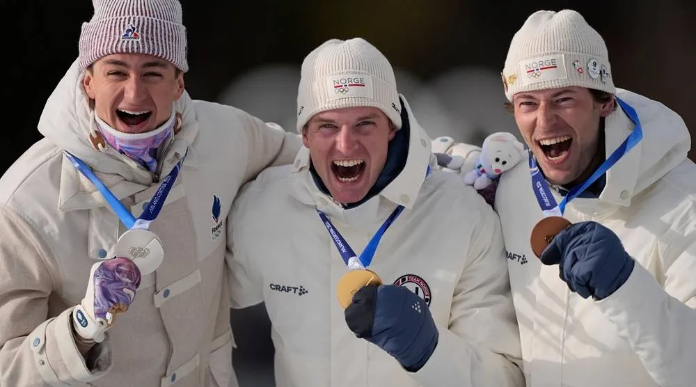 Silver medalist Eric Perrot, of France, from left, gold medalist Johan-Olav Botn, of Norway, and bronze medalist Sturla Holm Laegreid, of Norway, pose after the men's 20-kilometer individual biathlon race at the 2026 Winter Olympics in Anterselva, Italy, Tuesday, Feb. 10, 2026. (AP)