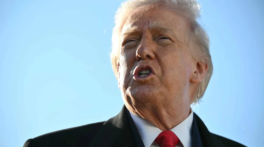 US President Donald Trump speaks to the press before boarding Air Force One at Pope Army Airfield at Fort Bragg, North Carolina on February 13, 2026, on his way to Palm Beach, Florida, to spend the weekend. (AFP)