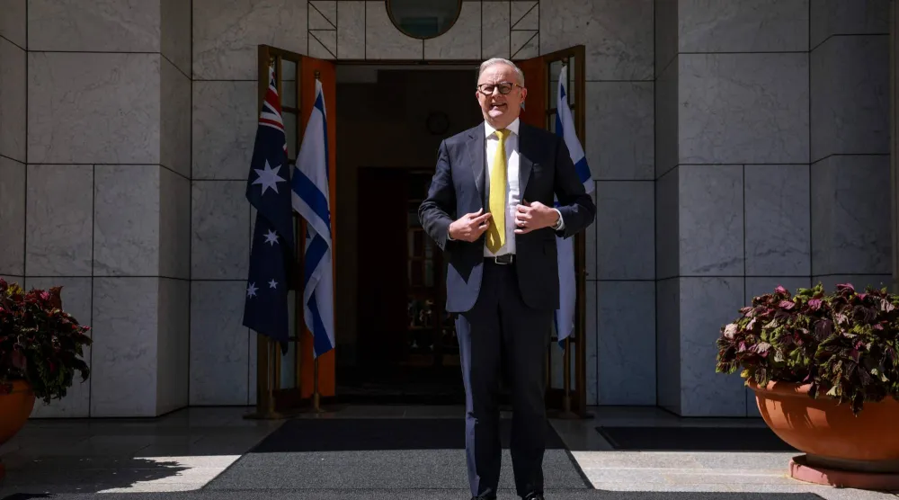 Australia's Prime Minister Anthony Albanese stands outside the entrance to his office at Parliament House in Canberra on February 11, 2026. (AFP)