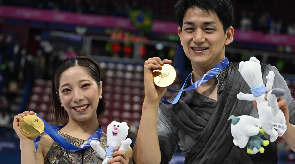Gold medalists Japan's Riku Miura and Japan's Ryuichi Kihara pose after the figure skating pair skating free skating final during the Milano Cortina 2026 Winter Olympic Games at Milano Ice Skating Arena in Milan on February 16, 2026. (AFP)