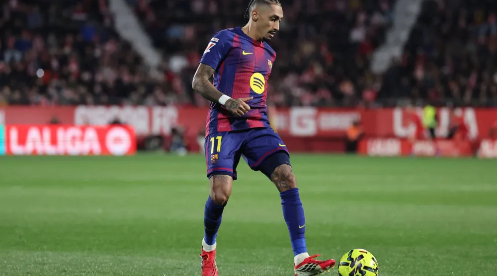 الجناح الدولي البرازيلي لبرشلونة رافينيا (أ.ف.ب)